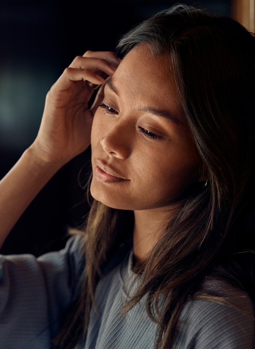 Woman strokes her hair