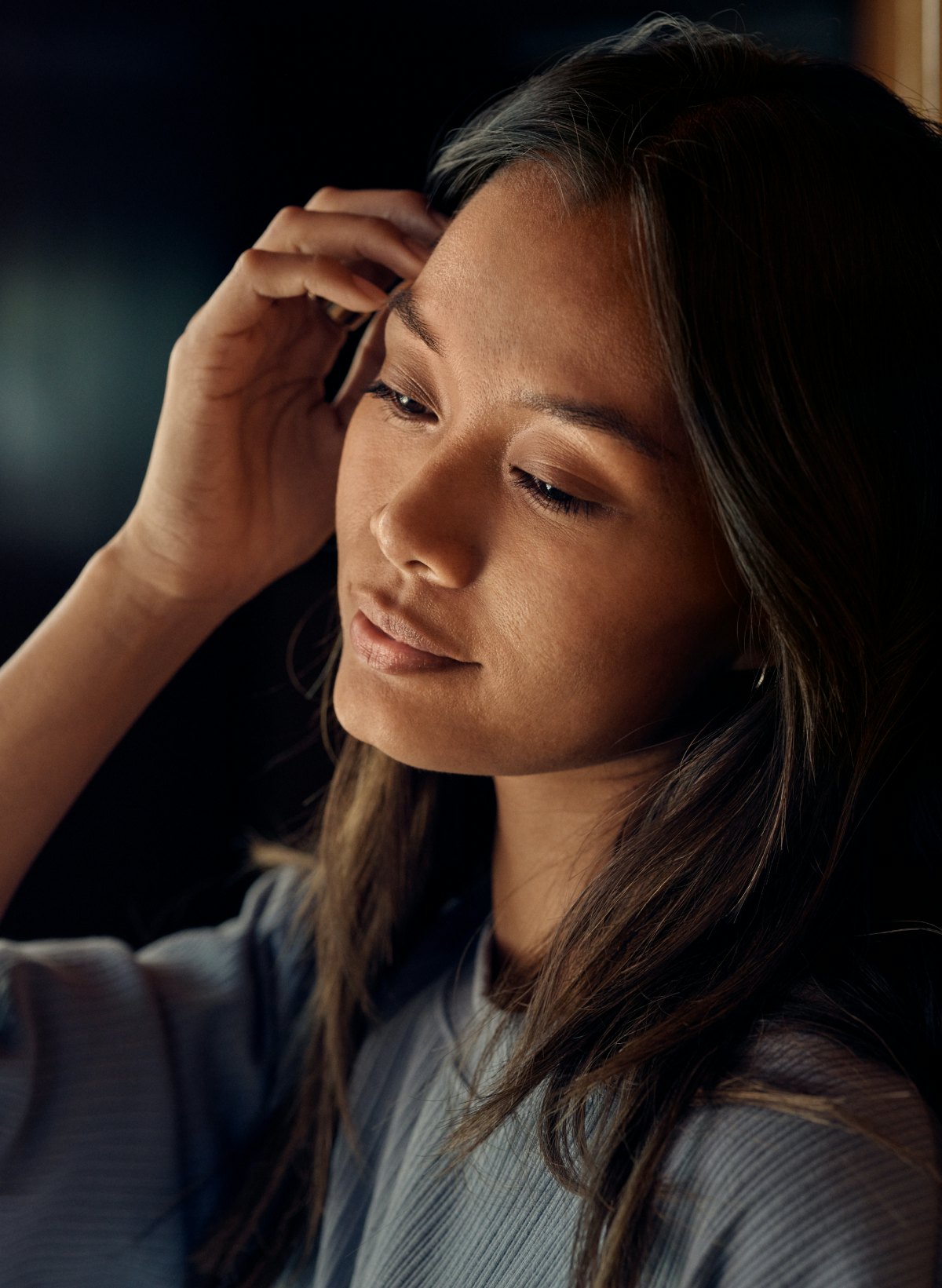 Woman strokes her hair